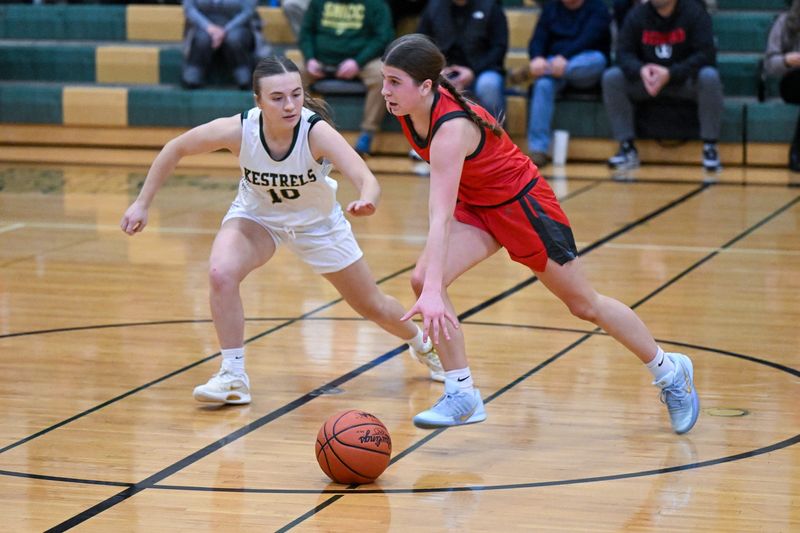 Bedford's Kenzi Burmeister is pressured by Nora Kinsey of St. Mary Catholic Central during a 39-36 Bedford victory on Tuesday, Dec. 9, 2025.