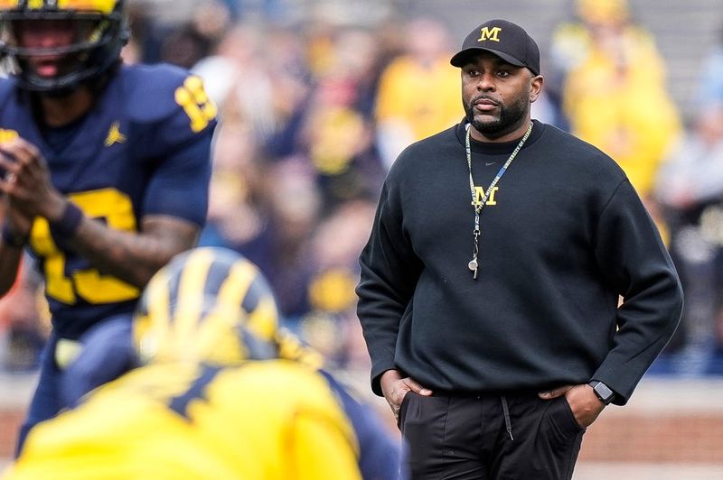 Michigan head coach Sherrone Moore watches a play behind quarterback Bryce Underwood (19) during the second half of the spring game at Michigan Stadium in Ann Arbor on Saturday, April 19, 2025.