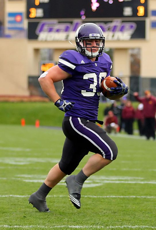 Nov 19, 2011; Evanston, IL, USA; Northwestern Wildcats running back Jacob Schmidt (39) runs for a touchdown in the second half against the Minnesota Golden Gophers at Ryan Field. Northwestern defeated Minnesota 28-13. Mandatory Credit: Dennis Wierzbicki-USA TODAY Sports