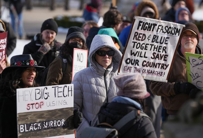 Demonstrators protest Tuesday, Dec. 16, 2025, during the Michiganders Against Data Centers rally at the state Capitol in Lansing.
