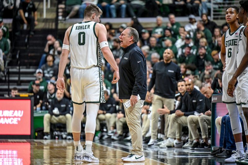 Michigan State's head coach Tom Izzo, right, talks with Jaxon Kohler during the first half in the game against Toledo on Tuesday, Dec. 16, 2025, at the Breslin Center in East Lansing.