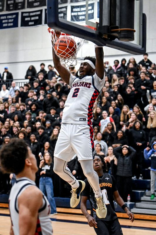 East Lansing's KJ Torbert dunks against Waverly with seconds remaining during the fourth quarter on Thursday, Dec. 18, 2025, at East Lansing High School.