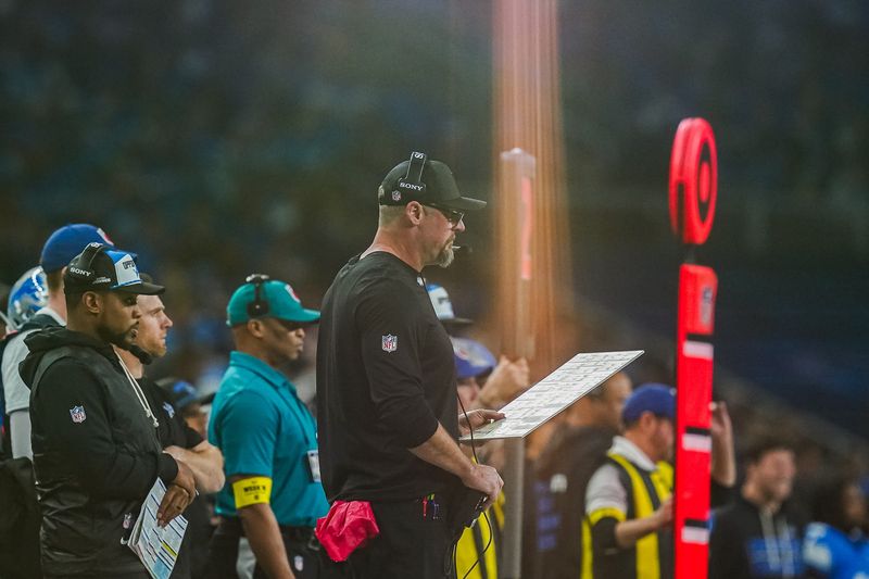 Detroit Lions head coach Dan Campbell holds his offensive play-call sheet during the first half against the Pittsburgh Steelers at Ford Field in Detroit on Sunday, Dec. 21, 2025.