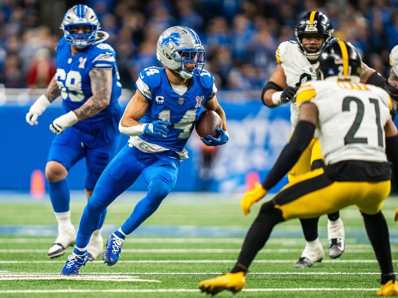 Detroit Lions wide receiver Amon-Ra St. Brown runs with the ball against the Pittsburgh Steelers in the second half at Ford Field on Sunday, Dec. 21, 2025.