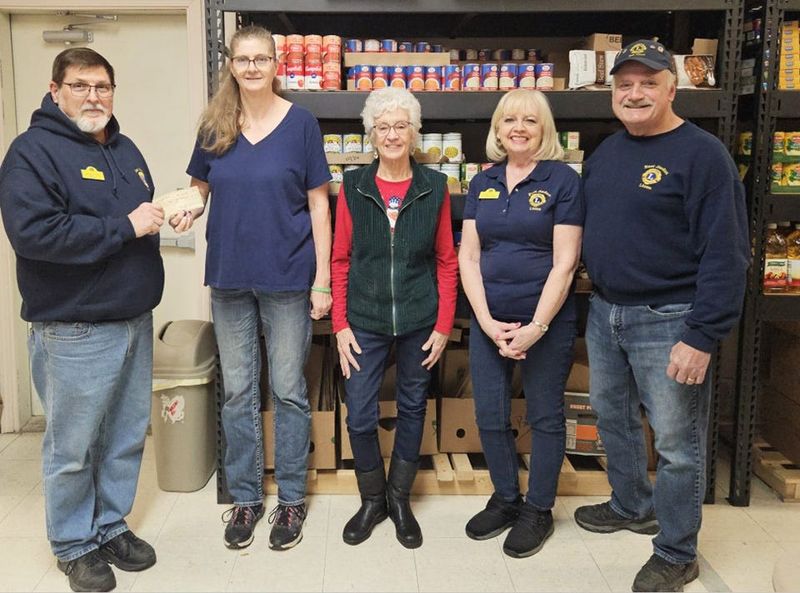 Pictured are EJ Lions Treasurer Terry Graham, Care & Share Food Pantry Director Lori Artgetsinger, EJ Lion Sherry Pursel, EJ Lions Secretary Linda Gocha and Past District Governor Dennis Gocha.