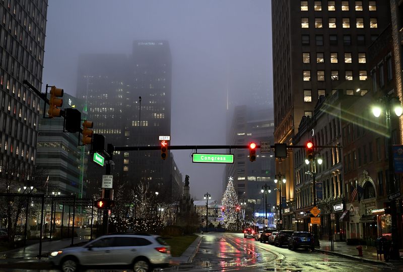 Buildings are enveloped in fog on a rainy evening in Detroit on Dec. 28, 2025.