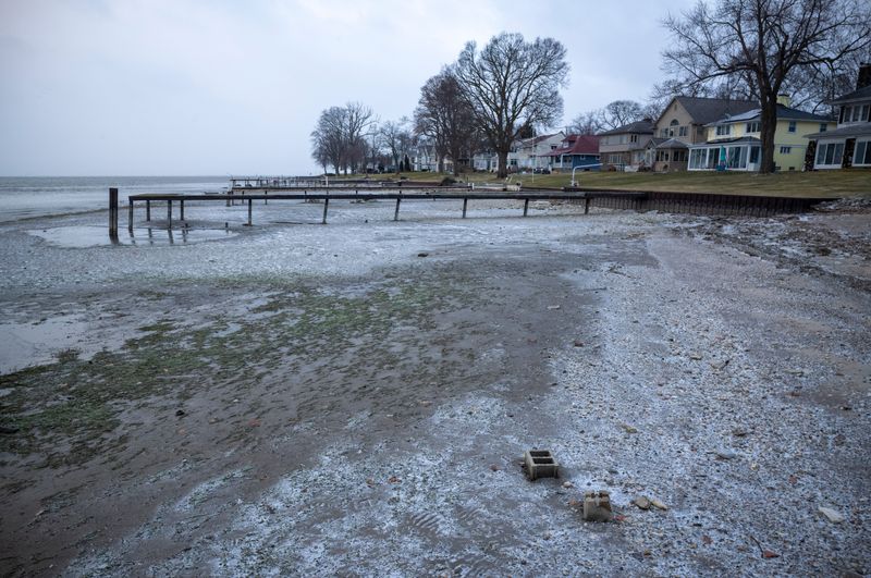 Water level on the Detroit River is significantly lower near this dock on Grosse Ile, Monday, Dec. 29, 2025. A seiche across the Great Lakes pushed the water from the west end of Lake Erie causing low water on the east side of Michigan.