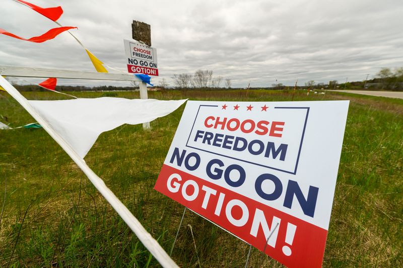 Signs against the building of a battery plant by the Gotion company can be seen on the Majestic Friesians horse farm owned by Lori Brock, in Big Rapids, April 30, 2024.