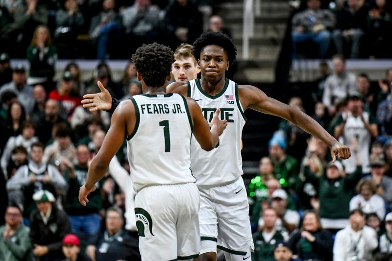 Michigan State's Cam Ward, right, celebrates with Jeremy Fears Jr. after Fears basket against Cornell during the second half on Monday, Dec. 29, 2025, at the Breslin Center in East Lansing.