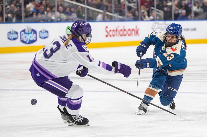 Plymouth's Mellissa Channell-Watkins (23) shoots the puck past Grace Zumwinkle (13) during second-period PWHL hockey game action between Vancouver and Minnesota on Dec. 27, 2025, in Edmonton, Alberta.