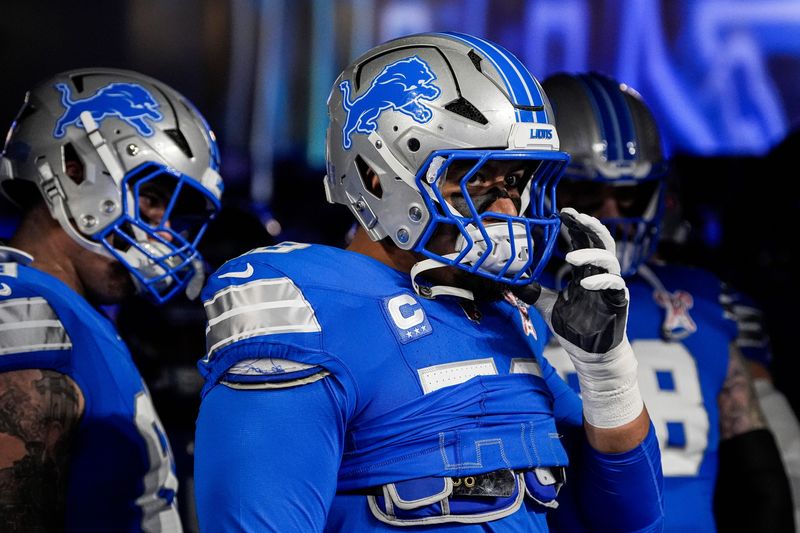 Detroit Lions offensive tackle Penei Sewell (58) in a huddle before warm up at Ford Field in Detroit on Sunday, Dec. 21, 2025.