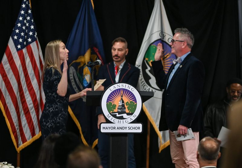 Ingham County Clerk Barb Byrum swears in Lansing City Clerk Chris Swope on Thursday, Jan. 1, 2026, during the city of Lansing's inauguration ceremony at the Impression 5 Science Center in downtown Lansing.
