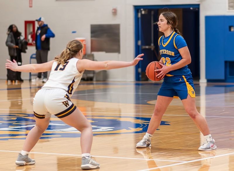 Jenna Flint of Jefferson surveys the floor as she is guarded by Glory Speweik during a 50-39 victory over Whiteford on Saturday, Jan. 3, 2026.