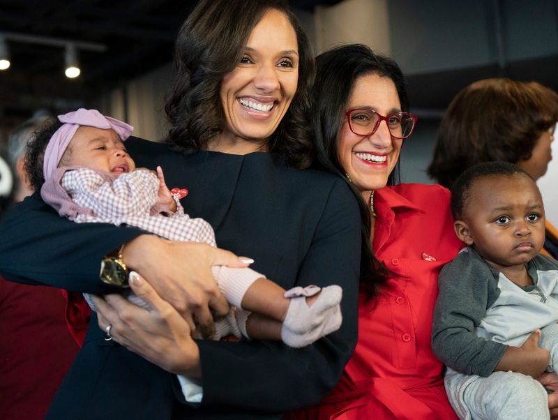 Detroit Mayor Sheffield, left, holds Zoe Reese, 2, of Livonia as she stands with Dr. Mona Hanna after announcing that Detroit will be the largest city in the nation to participate in RX Kids, a mom and baby support cash program for local families on Monday, Jan. 5, 2026 at the Franklin Wright Settlements in Detroit.
