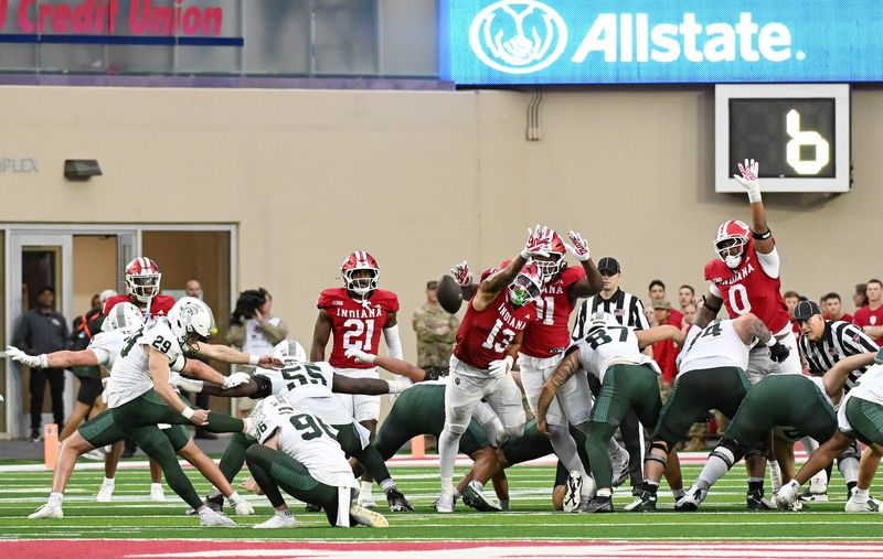 Oct 18, 2025; Bloomington, Indiana, USA; Indiana Hoosiers linebacker Kellan Wyatt (13) attempts to block a field goal during the second half against the Michigan State Spartans at Memorial Stadium. Mandatory Credit: Robert Goddin-Imagn Images
