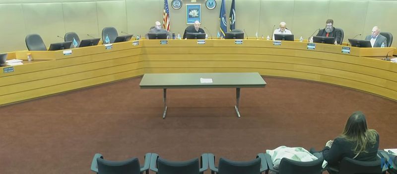 The Monroe County Board of Commissioners meets with four empty seats.