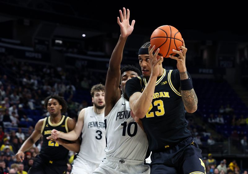 Michigan Wolverines forward Yaxel Lendeborg (23) drives the ball to the basket as Penn State Nittany Lions forward Josh Reed (10) defends during the second half at Bryce Jordan Center in University Park, Pennsylvania, on Tuesday, Jan. 6, 2026.