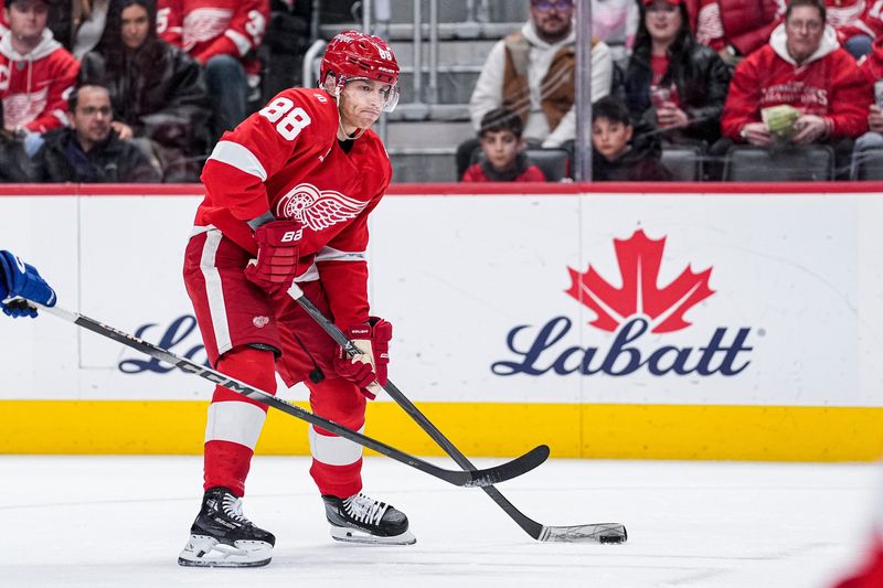 Detroit Red Wings right wing Patrick Kane (88) shoots the puck against Vancouver Canucks right wing Brock Boeser (6) during the first period at Little Caesars Arena in Detroit on Thursday, Jan. 8, 2026.