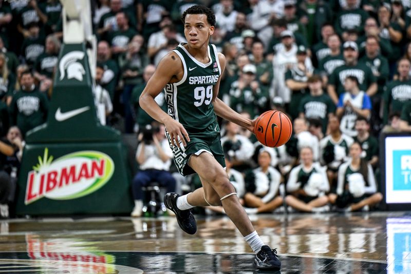 Michigan State's Divine Ugochukwu moves the ball agains tNorthwestern during the first half on Thursday, Jan. 8, 2026, at the Breslin Center in East Lansing.