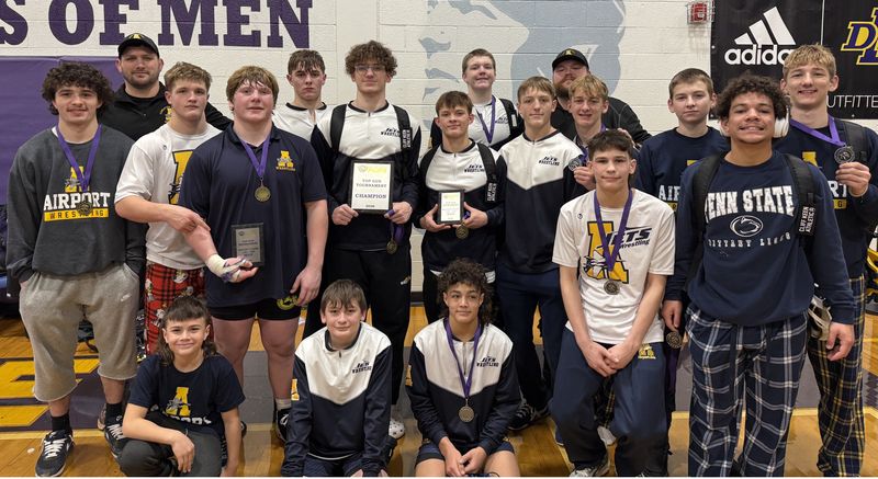 Airport's wrestling team celebrates after winning the Warren DeLaSalle Top Gun Tournament on Saturday, Jan. 10, 2026.