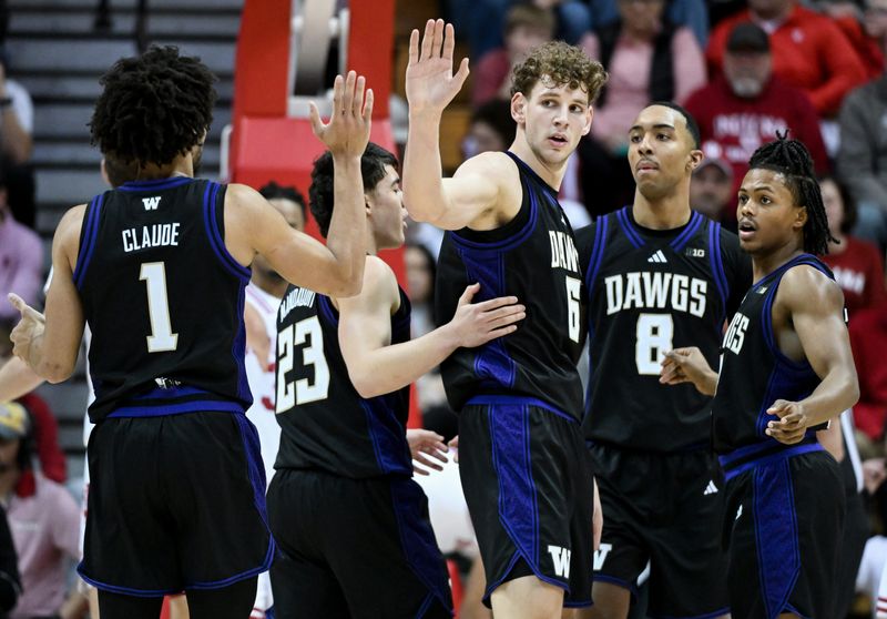 Washington Huskies guard Desmond Claude (1) and forward Hannes Steinbach (6) high-five after a play at Simon Skjodt Assembly Hall in Bloomington, Indiana.