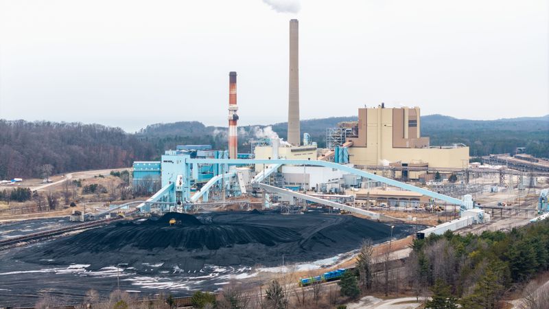 Piles of coal can be seen at Consumers Energy's J.H. Campbell Generating Plant in West Olive earlier this year. For the past year, Consumers Energy has continued running the coal-burning power plant in west Michigan's Ottawa County under an order from President Donald Trump's administration.