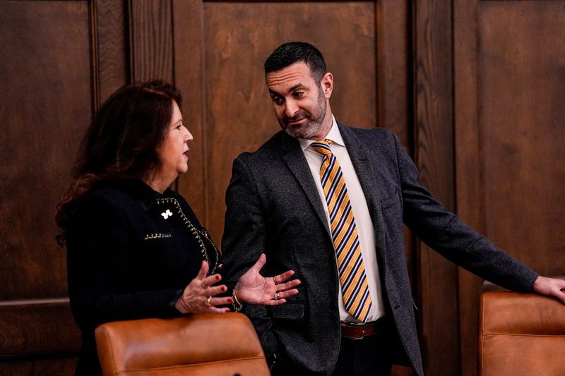 U-M Regent Sarah Hubbard, left, talks to Regent Jordan B. Acker during a special regents meeting at University of Michigan’s Ruthven Building in Ann Arbor on Monday, Jan. 12, 2026.