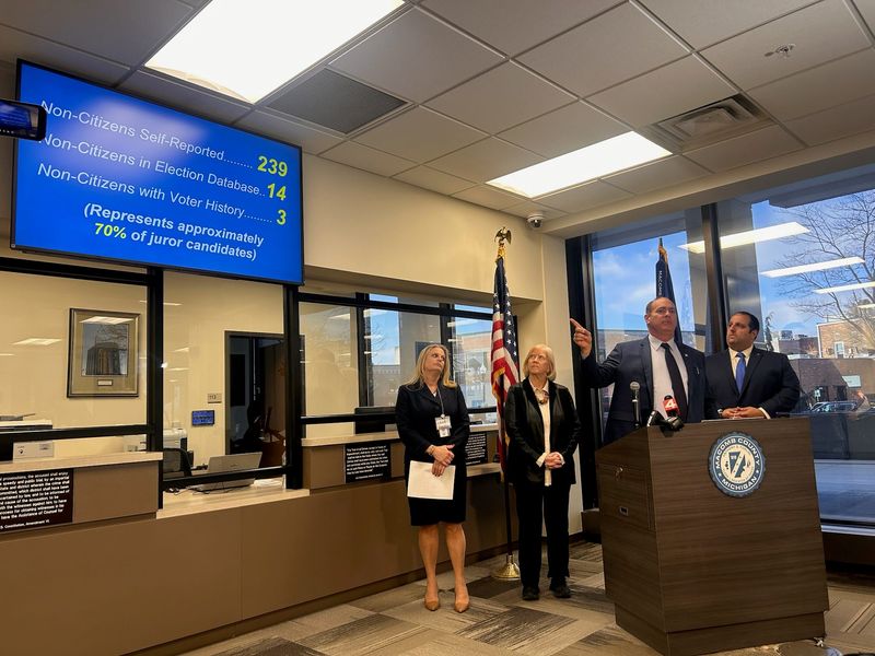 Macomb County Clerk/Register of Deeds Anthony Forlini, center, speaks Jan. 12, 2026 in the Circuit Court jury room with, from left, Monika Rittner, supervisor of records for the court; County Public Works Commissioner Candice Miller, and state Rep. Joseph Aragona.