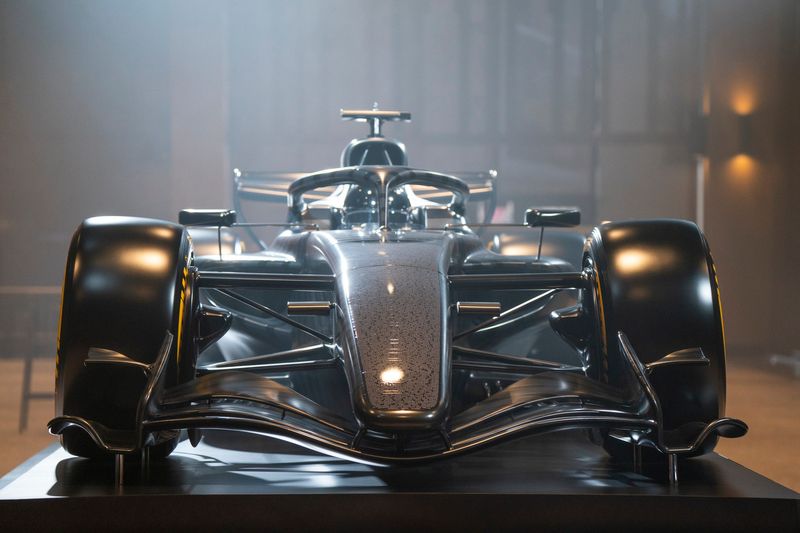 A reveal of the Cadillac Formula 1 race car takes place during the Detroit Free Press Breakfast Club that hosted General Motors President Mark Reuss and Penske Corp. Chairman Roger Penske on Tuesday, Jan. 13, 2026 at the new Hudson's office space in Detroit.