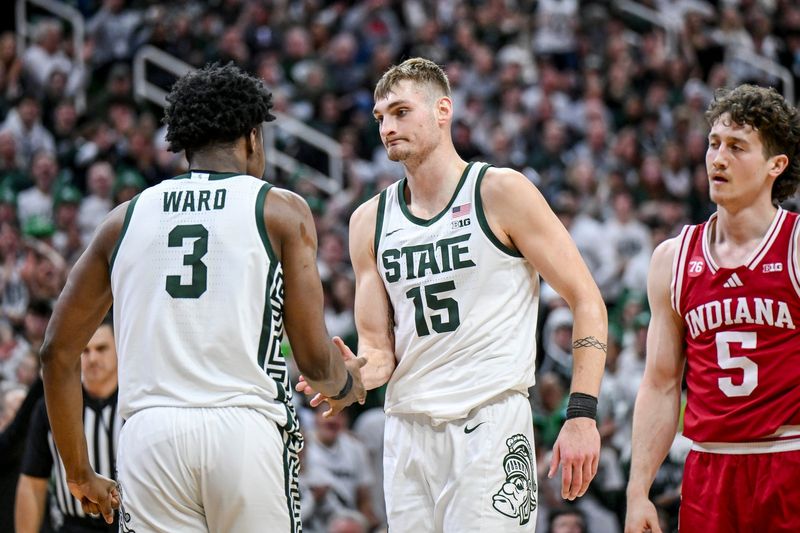 Michigan State's Carson Cooper, right, celebrates with Cam Ward, left, after Ward's score an Indiana foul during the second half on Tuesday, Jan. 13, 2026, at the Breslin Center in East Lansing.