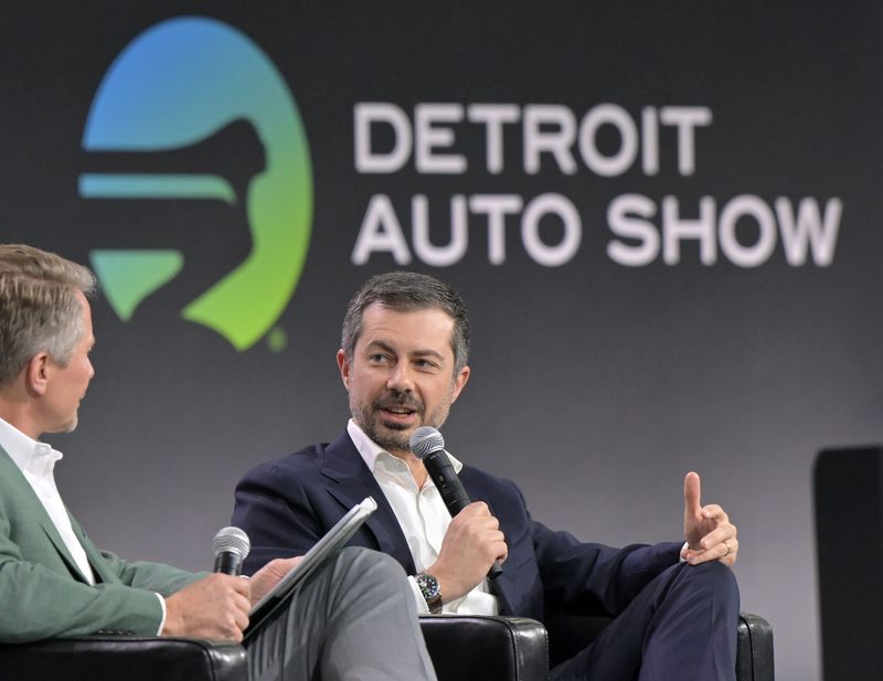 Former U.S. Transportation Secretary Pete Buttigieg during a conversation with Michigan State University president Kevin M. Guskiewicz, left, at the Detroit Auto Show at Huntington Place in Detroit on Jan. 14, 2026.