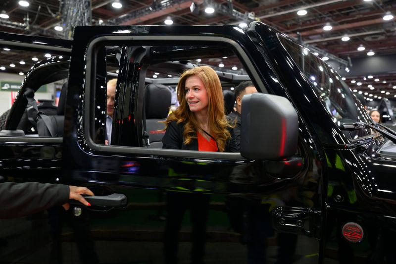 Michigan State Senator Mallory McMorrow tests out a Jeep Wrangler Rubicon at the Detroit Auto Show at Huntington Place, in Detroit, January 14, 2026.