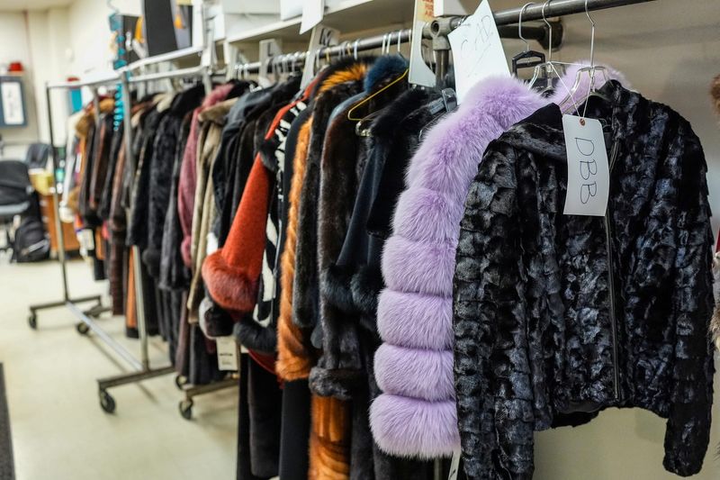 Furs hang on a clothing rack that people purchased at Dittrich Furs, which announced it will close in April after 133 years in business in Detroit, on Wednesday, Jan. 14, 2026.