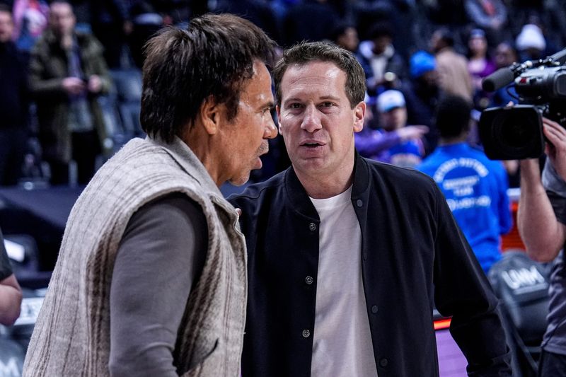 Detroit Pistons owner Tom Gores, left, talks to Phoenix Suns owner Mat Ishbia after the game between the Detroit Pistons and the Phoenix Suns at Little Caesars Arena in Detroit on Thursday., Jan. 15, 2026.