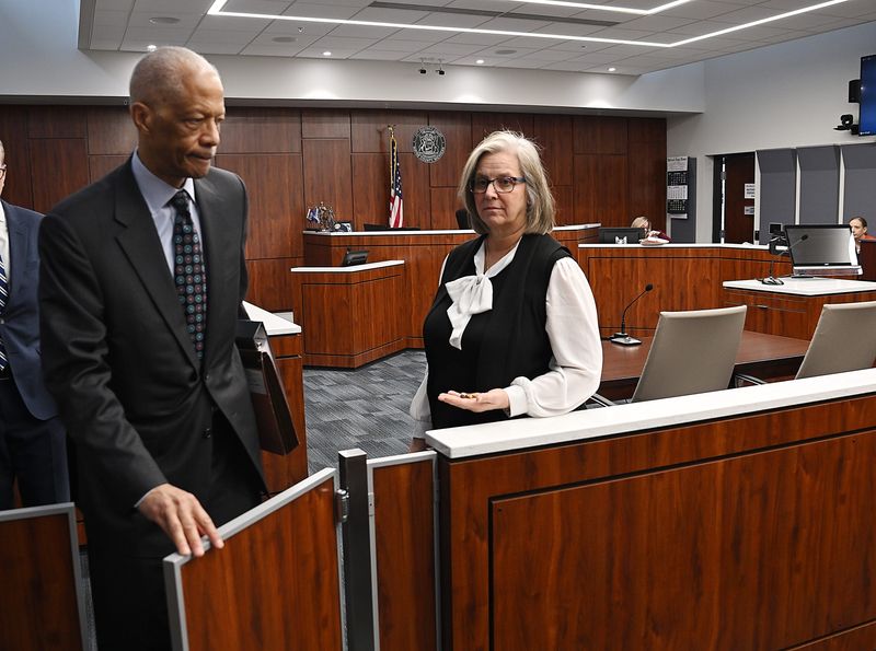 Elizabeth Puleo-Tague, the mother of a teen who killed his friend in a reckless driving crash in Grosse Pointe, leaves the courtroom with her attorney Gerald Evelyn after a judicial disqualification hearing Jan. 16, 2026, in Redford. The dead teen's mom, Anne Vanker, used a citizen's warrant to charge Puleo-Tague with involuntary manslaughter.