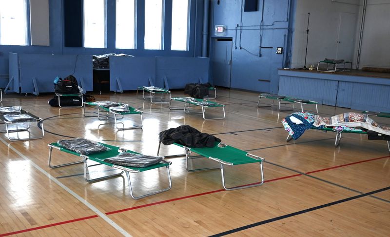 Cots are spaced around the Eby Center gym for those who need a warm place to sleep during the cold nights.
