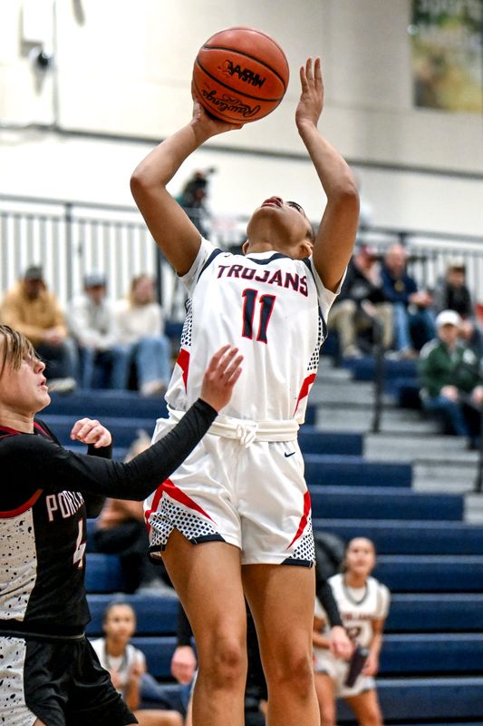 East Lansing's Sydney Black scores against Portland during the third quarter on Tuesday, Jan. 20, 2026, at East Lansing High School.