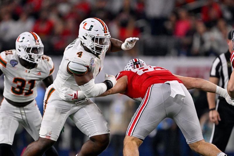 Miami Hurricanes defensive lineman Rueben Bain Jr. rushes the line during the 2025 Cotton Bowl and quarterfinal game of the College Football Playoff at AT&T Stadium, Dec. 31, 2025.