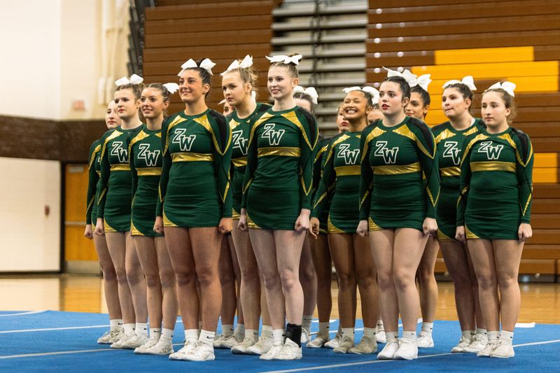 Zeeland West's Addysen Miller, front and center, leads the Holland Sentinel All-Area Competitive Cheer Team.