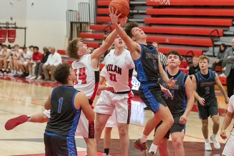 Grady Brooks of Jefferson is defended inside by Milan's Zach Farmer during a 66-46 Jefferson victory on Friday, Jan. 23, 2026.