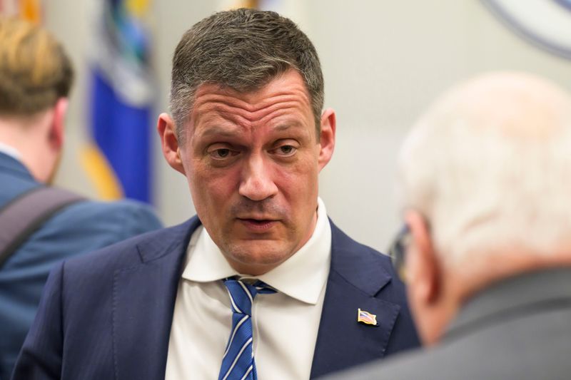 Birmingham attorney Kevin Kijewski, a candidate vying for the GOP nomination for attorney general of Michigan, left, chats with voters after participating in a debate with fellow candidate Eaton County Prosecutor Doug Lloyd on Jan. 22, 2026, at the Waterford Township Hall in Waterford. Kijewski is seeking to become the state's chief law enforcement officer with no experience as a prosecutor. The former Catholic school administrator mostly practices law in family court, handling divorces and child custody cases.