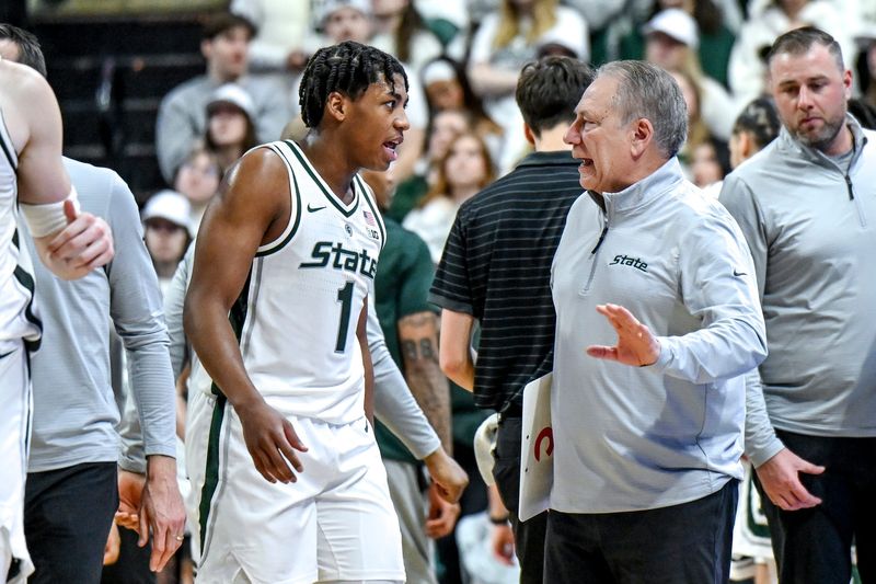 Michigan State's head coach Tom Izzo, right, talks with Jeremy Fears Jr. during the first half in the game against Maryland on Saturday, Jan. 24, 2026, at the Breslin Center in East Lansing.