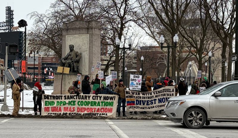 Protesters gather in 6 degree temperatures at a rally near Grand Circus Park in Detroit on Saturday, Jan. 24.