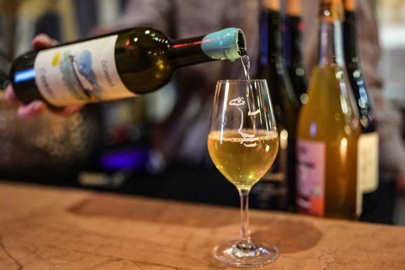 Sydney Jordan, 24, of Detroit, pours a glass of Cerreto by Antonio Gismondi to serve at Chenin, a small wine bar in the Siren Hotel in downtown Detroit on Thursday, Jan. 22, 2026.