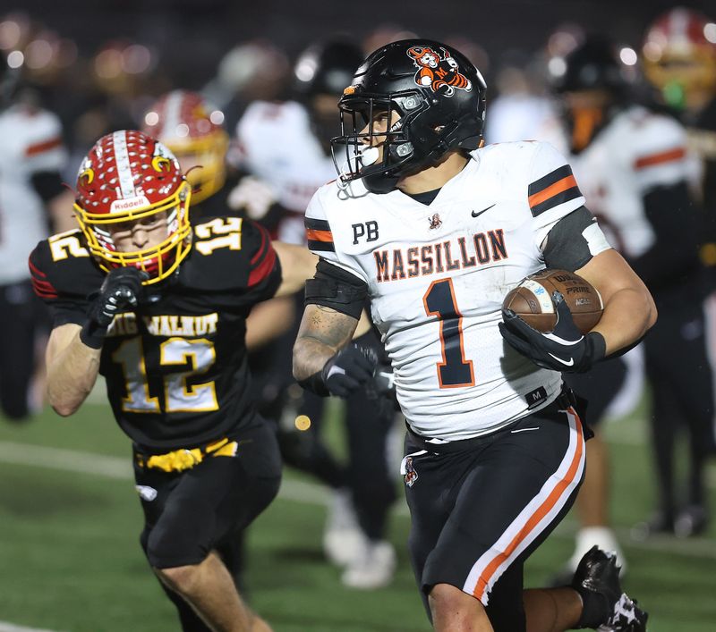 Massillonâ€™s Savior Owens beats Big Walnut's Cole Hysell into the end zone for a first-half touchdown in an OHSAA Division II regional final, Friday, Nov. 21, 2025, in Zanesville.