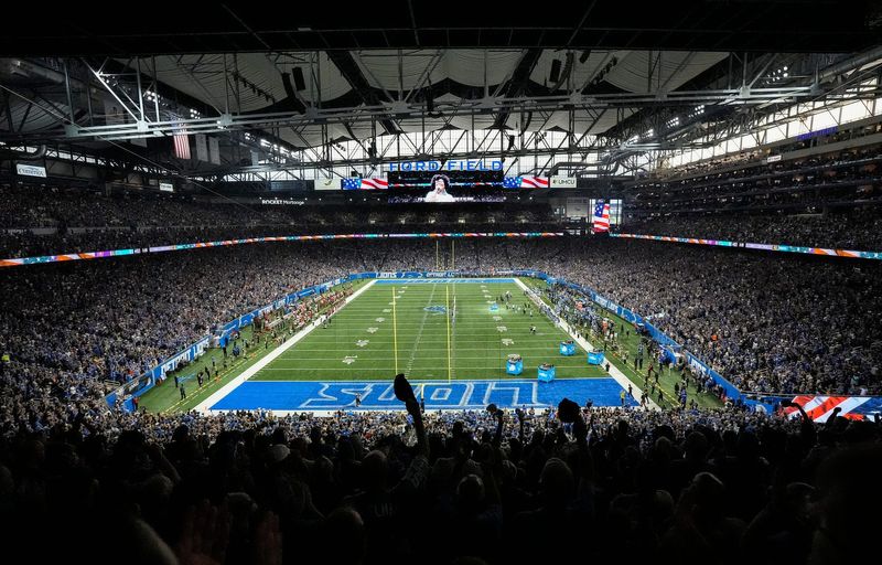 Football fans cheer on during the national anthem before the game between Detroit Lions and Tampa Bay Buccaneers at Ford Field in Detroit on Sunday, September 15, 2024.