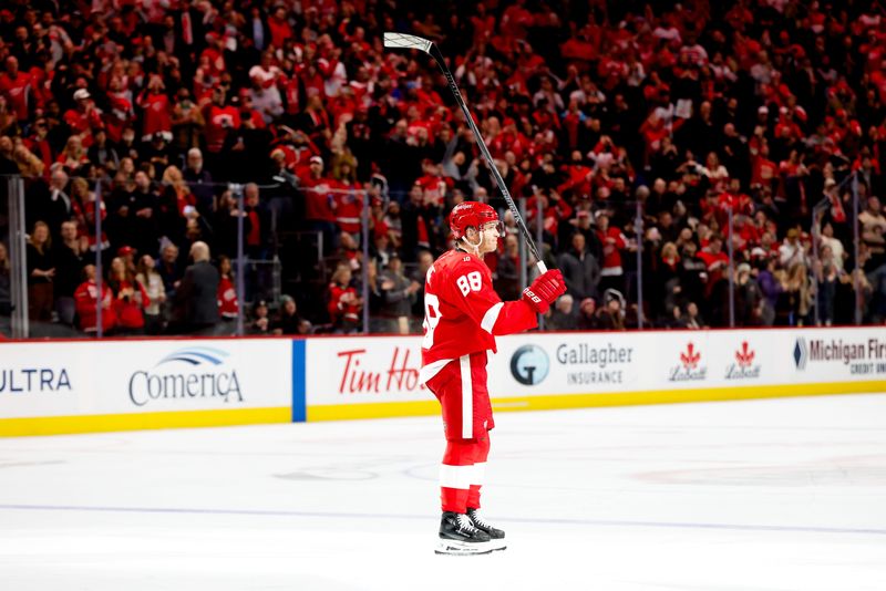 Detroit Red Wings right wing Patrick Kane (88) celebrates after he gets his 1,375th career point in the second period against the Washington Capitals at Little Caesars Arena in Detroit on Thursday, Jan. 29, 2026.