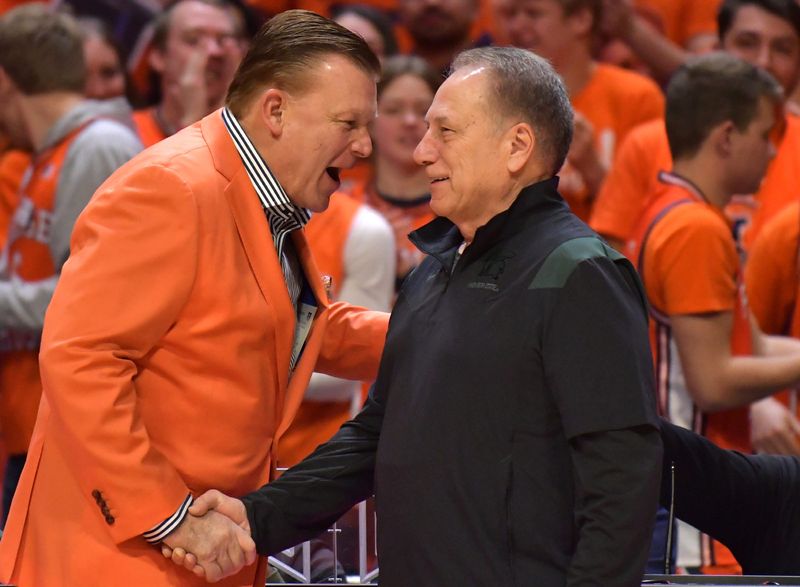 Jan 13, 2023; Champaign, Illinois, USA; Illinois Fighting Illini head coach Brad Underwood, left, shakes hands with Michigan State Spartans head coach Tom Izzo before the first half at State Farm Center. Mandatory Credit: Ron Johnson-USA TODAY Sports