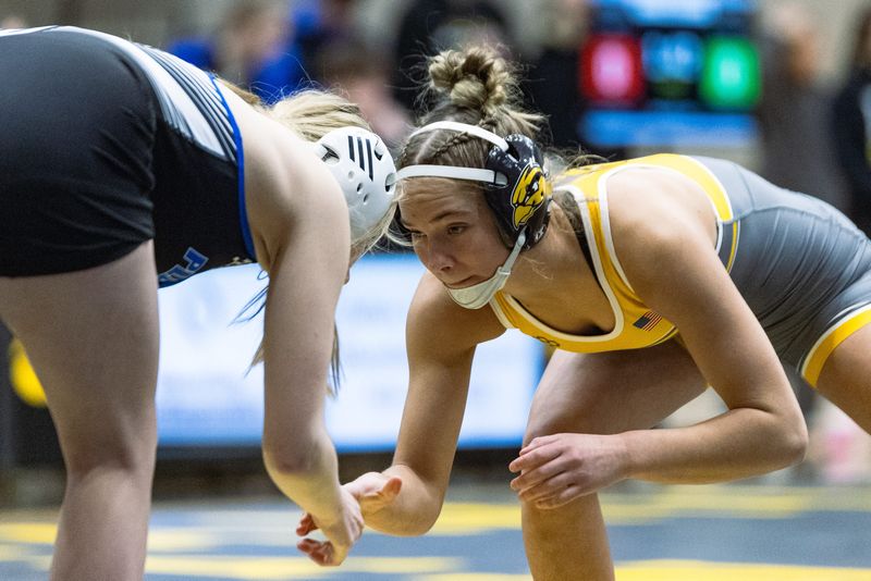 Hamilton's Korra Kapenga shares her opponents hand before the match on Friday, Jan. 30.