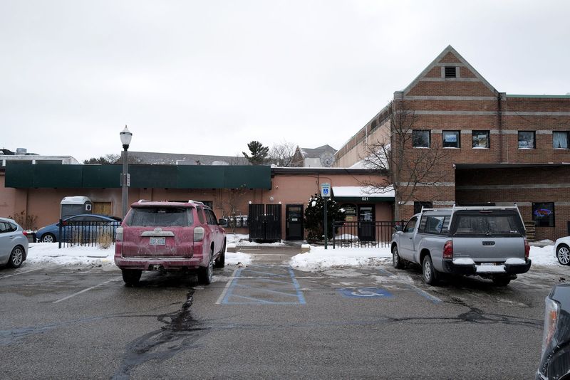 The site a developer has proposed for a new mixed-use, 13-story development is behind The Peanut Barrel in East Lansing as shown here from the parking lot.